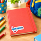 Airplane sticker on a colorful travel notebook