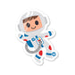 A die-cut vinyl sticker of a cartoon-style astronaut with a white helmet and blue suit, smiling and holding a device.