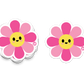 Bright daisy-style flower sticker with pink petals and smile
