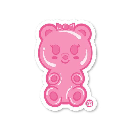 A pink die-cut vinyl sticker in the shape of a gummy bear character with a bow and arms, designed for use as a decal.